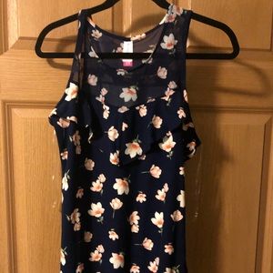 Sleeveless ruffled floral top with mesh inserts